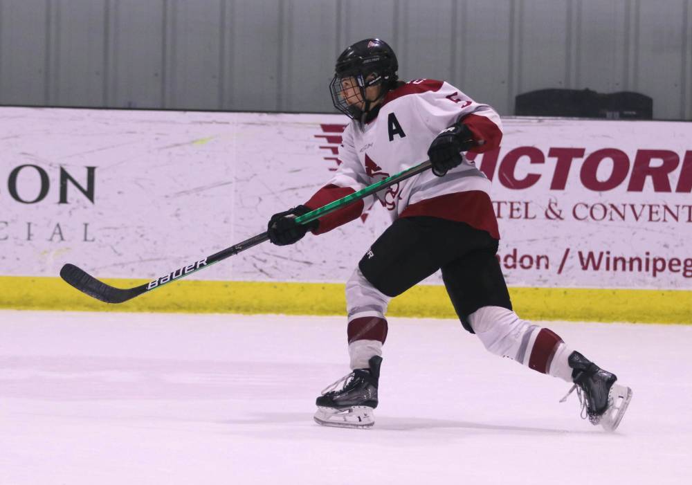 Kathryn Fischer unloads with a slapshot in Saturday's AC Cougars game against the NDSU Bisons. (Matt Packwood/The Brandon Sun)