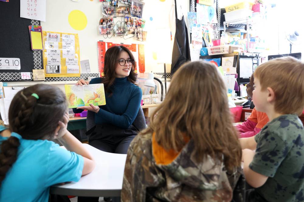 Ashley Martinez-Fong, a first-year faculty of education student at Brandon University, reads to Grade 3 students at Earl Oxford School on Tuesday as part of a practicum and in honour of I Love to Read Month. First-year integrated bachelor of arts and bachelor of education students have been reading to K-4 students weekly at Earl Oxford during the month of February. (Tim Smith/The Brandon Sun)