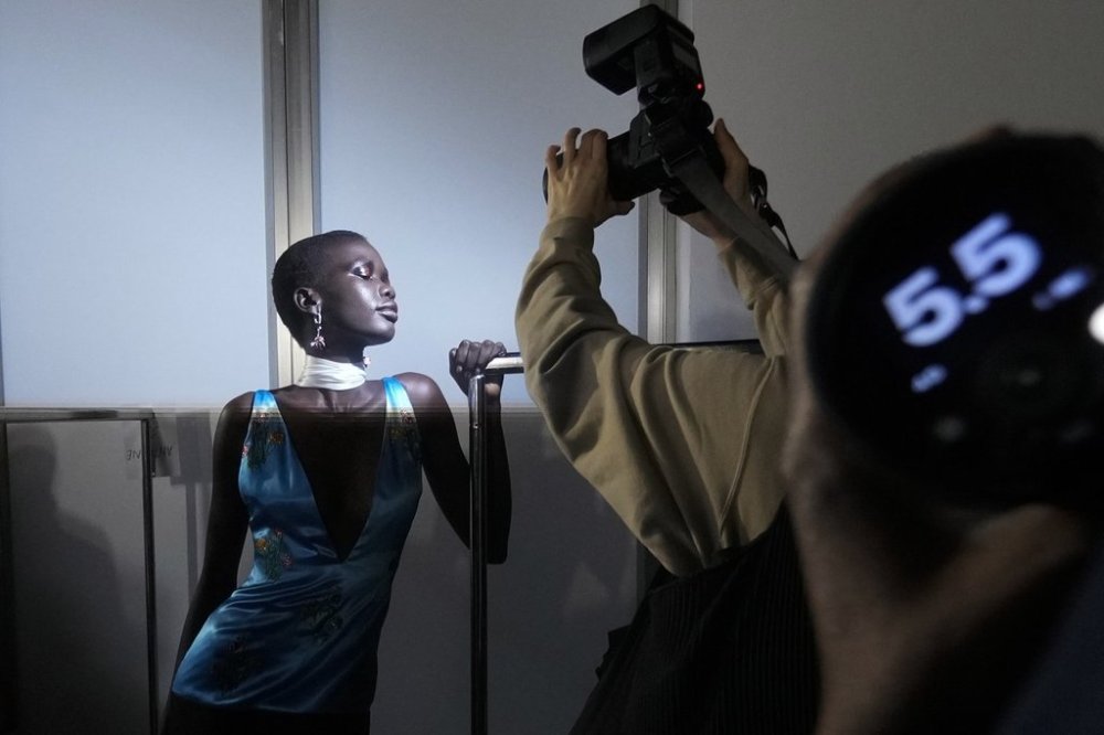 Model Achol Ayor gets ready in the backstage prior a Marni Fall/Winter 2025-2026 Womenswear fashion show, during the Fashion Week, in Milan, Italy, Wednesday, Feb. 26, 2025. (AP Photo/Luca Bruno)