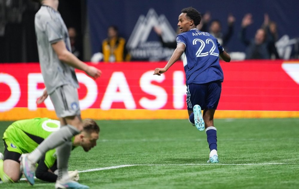 Vancouver Whitecaps' Ali Ahmed (22) celebrates his goal against CF Montreal goalkeeper Jonathan Sirois during the second half of an MLS soccer game in Vancouver, on Saturday, April 1, 2023. THE CANADIAN PRESS/Darryl Dyck