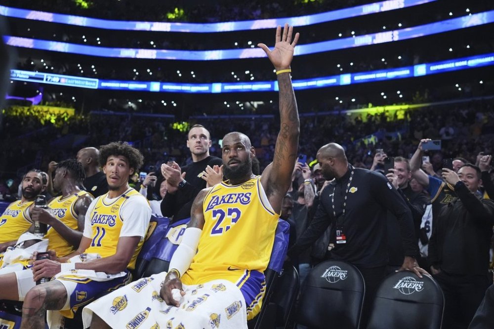 Los Angeles Lakers forward LeBron James waves to the crowd after making a 3-point basket to go over the 50,000 career point mark during the first half of an NBA basketball game against the New Orleans Pelicans, Tuesday, March 4, 2025, in Los Angeles. (AP Photo/Jae C. Hong)