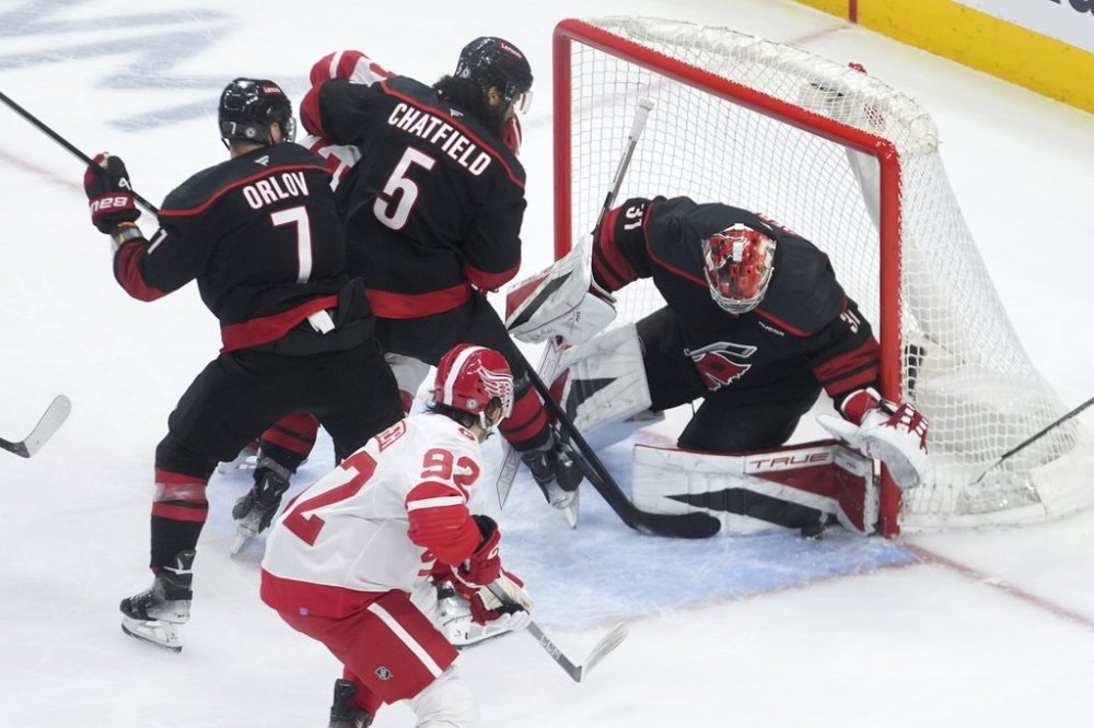 Carolina Hurricanes goaltender Frederik Andersen (31) stops a Detroit Red Wings' Marco Kasper shot in the second period of an NHL hockey game Tuesday, March 4, 2025, in Detroit. (AP Photo/Paul Sancya)
