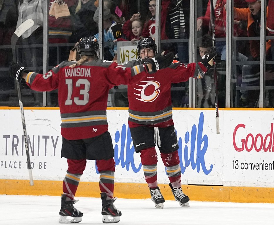 Ottawa Charge's Gabbie Hughes (17) celebrates her game-winning goal against the New York Sirens with Tereza Vanisova (13) during overtime period PWHL hockey action in Ottawa, on Wednesday, Feb. 26, 2025. THE CANADIAN PRESS/Justin Tang
