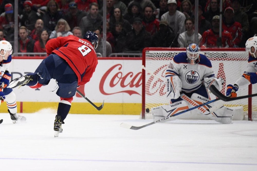 Washington Capitals left wing Alex Ovechkin (8) scores against Edmonton Oilers goaltender Calvin Pickard (30) during the second period of an NHL hockey game, Sunday, Feb. 23, 2025, in Washington. (AP Photo/Nick Wass)