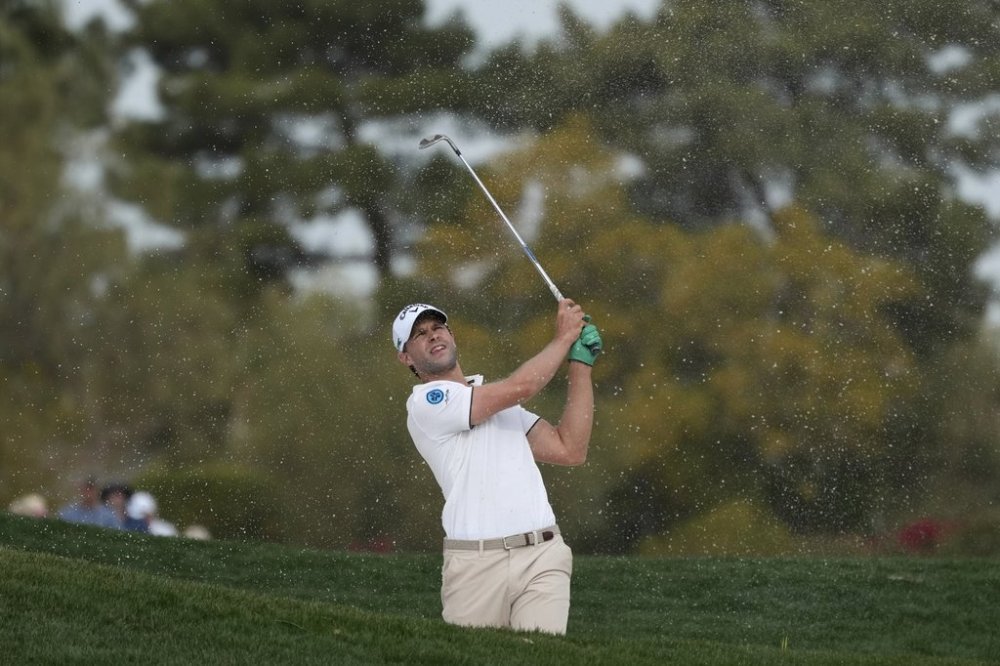 Thomas Detry, of Belgium, hits out of a fairway bunker at the second hole during the final round of the Phoenix Open golf tournament at TPC Scottsdale Sunday, Feb. 9, 2025, in Scottsdale, Ariz. (AP Photo/Ross D. Franklin)
