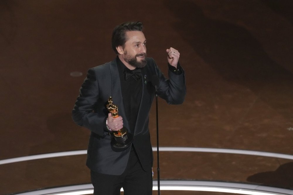 Kieran Culkin accepts the award for best performance by an actor in a supporting role for