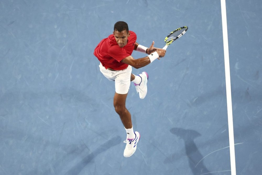 Montreal's Félix Auger-Aliassime rallied past Portugal's Nuno Borges 4-6, 6-3, 7-5 on Wednesday to reach the quarterfinals at the Dubai Tennis Championships. Auger-Aliassime hits a return to Taylor Fritz of the United States during their United Cup tennis match in Perth, Australia, Sunday, Dec. 29, 2024. THE CANADIAN PRESS/AP/Trevor Collens