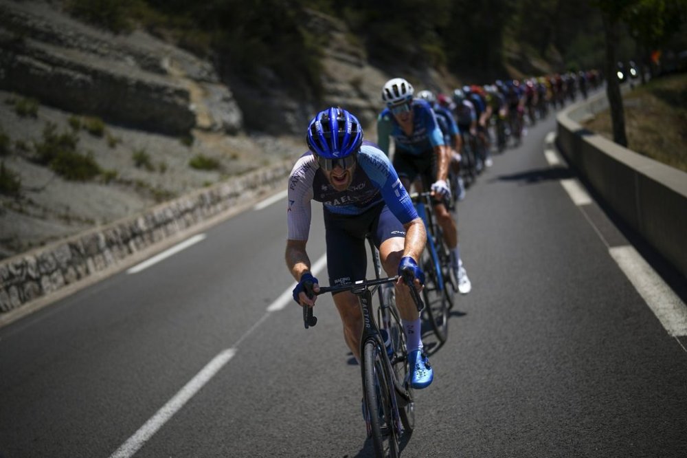 Canada's Derek Gee rides in the pack during the twentieth stage of the Tour de France cycling race over 132.8 kilometres (82.5 miles) with start in Nice and finish in La Couillole pass, France, Saturday, July 20, 2024. THE CANADIAN PRESS/AP-Daniel Cole
