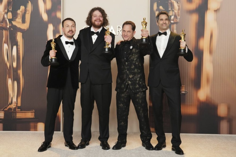 From left, Gints Zilbalodis, Matiss Kaza, Ron Dyens and Gregory Zalcman, winners of the award for best animated feature film for