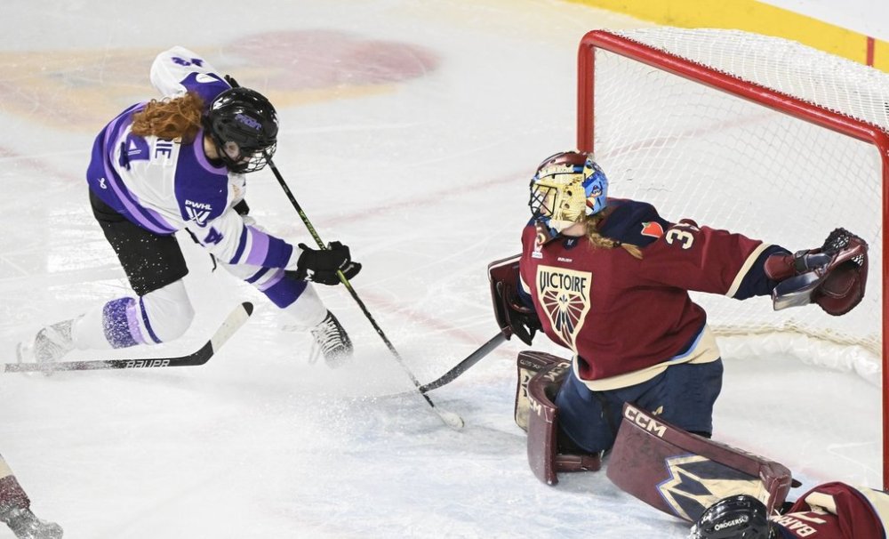 Minnesota Frost's Dominique Petrie (14) moves in on Montreal Victoire goaltender Ann-Renee Desbiens during third period PWHL hockey action in Laval, Que. Tuesday, March 4, 2025. THE CANADIAN PRESS/Graham Hughes