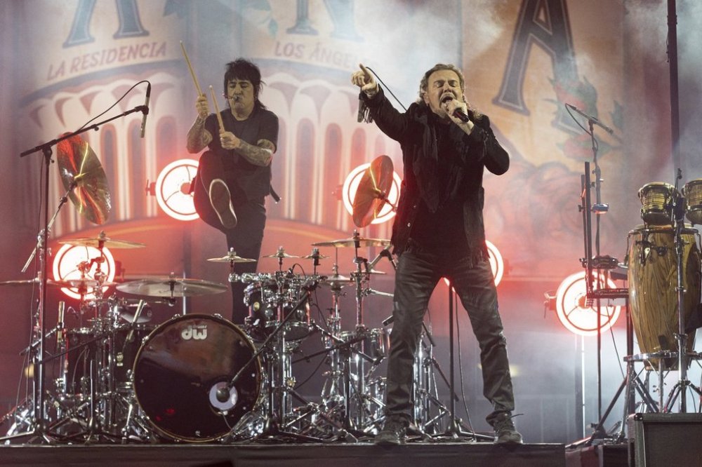 FILE - Alex Gonzalez, left, and Fher Olvera of the Mexican rock band Mana perform at the Los Angeles Forum on Nov. 15, 2021, in Inglewood, Calif. (Photo by Willy Sanjuan/Invision/AP, File)