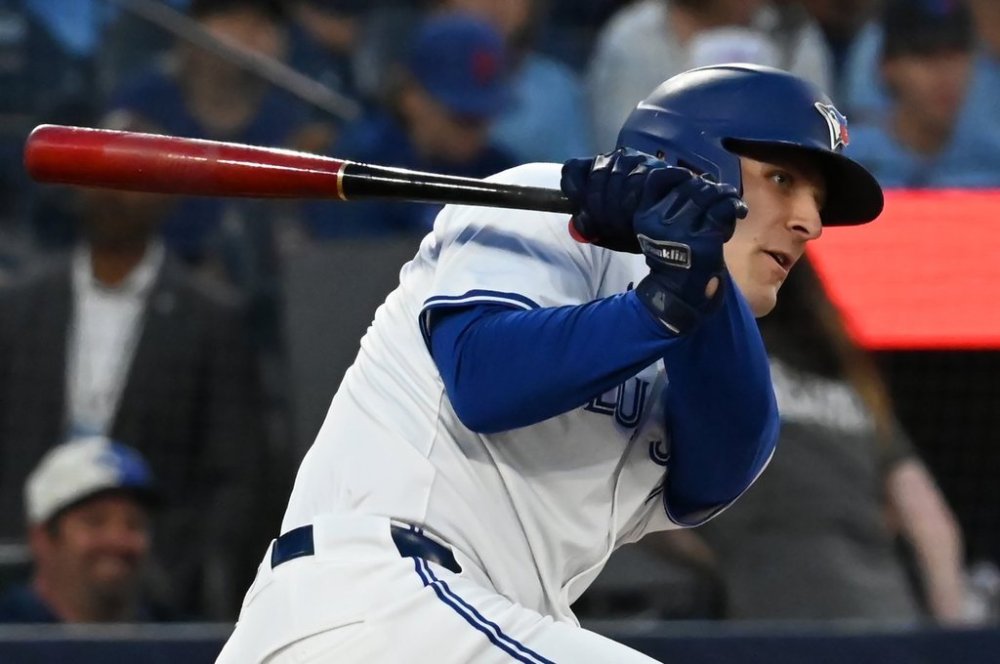 Blue Jays right-fielder Daulton Varsho (25) hits a single against the New York Mets during first-inning MLB action in Toronto on Tuesday Sept. 10, 2024. THE CANADIAN PRESS/Jon Blacker