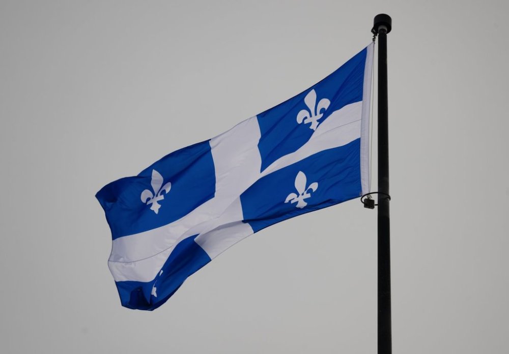 The Quebec flag flies on top of the national assembly’s main tower, January 18, 2023 in Quebec City. THE CANADIAN PRESS/Jacques Boissinot