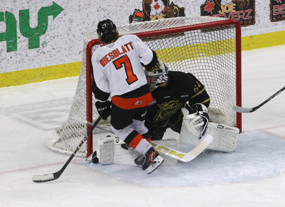 Medicine Hat Tigers forward Oasiz Wiesblatt (7) makes contact with Brandon Wheat Kings goalie Carson Bjarnason (64) as the puck drops in for the first goal of the game as the Tigers went on to a 5-0 victory in Western Hockey League play at Westoba Place on Saturday. (Perry Bergson/The Brandon Sun)
March 1, 2025