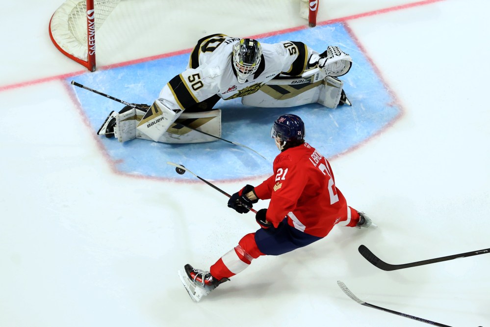Brandon Wheat Kings Ethan Eskit (50) keeps an eye on Regina Pats forward Ashton Brown (21) during the Western Hockey League regular season finale for both clubs at Brandt Centre on Saturday. Eskit made 24 saves in a 4-0 Brandon victory. (Keith Hershmiller Photography)
March 22, 2025