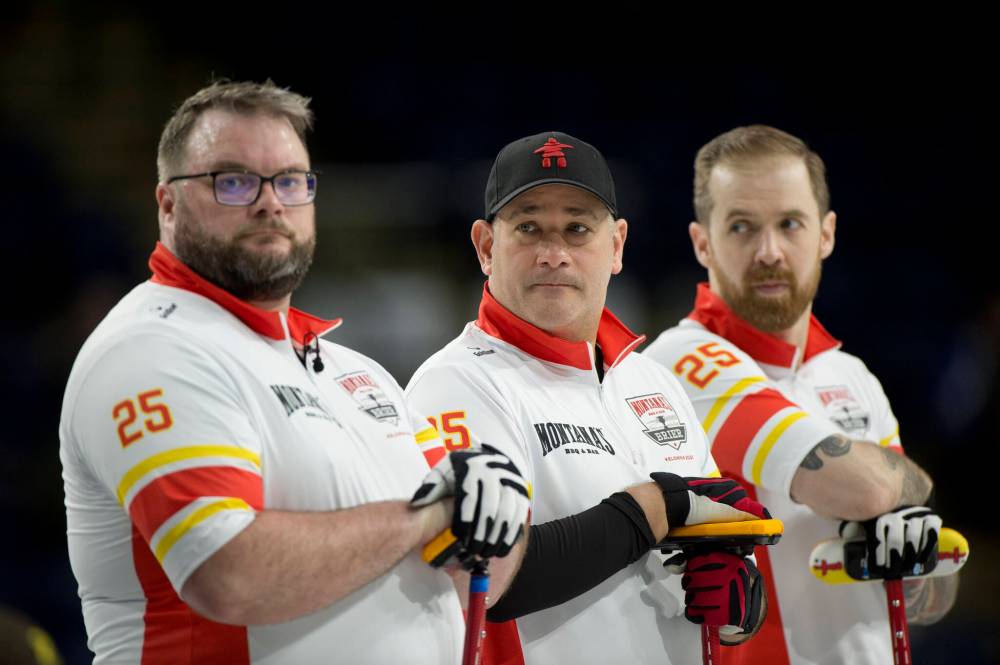 Team Nunavut lead Peter Van Strien and second Justin McDonell flank third Sheldon Wettig of Brandon during draw 7 action at the Brier. (Photo courtesy Curling Canada)