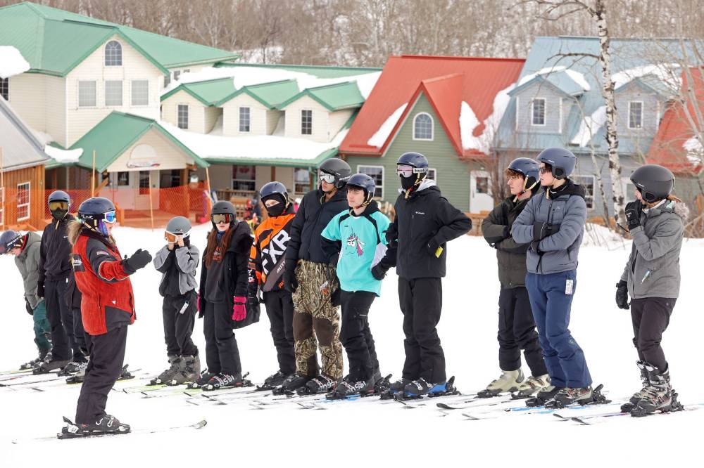 A ski instructor goes over a lesson with students on a trip to Asessippi on Friday.