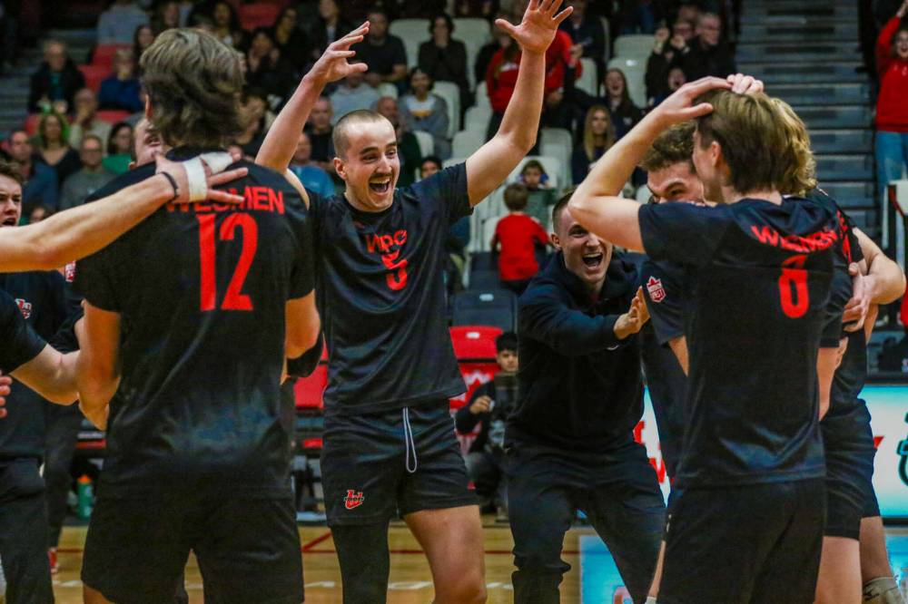 The Winnipeg Wesmen celebrate booking a spot at the U Sports men’s volleyball national championship in two weeks time. (Photo courtesy David Larkins)