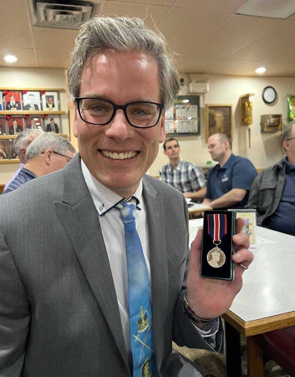 Brandon's Grant Hamilton holds up the King Charles III Coronation Medal he received Monday evening at the Royal Canadian Legion Branch in Brandon. (Submitted)