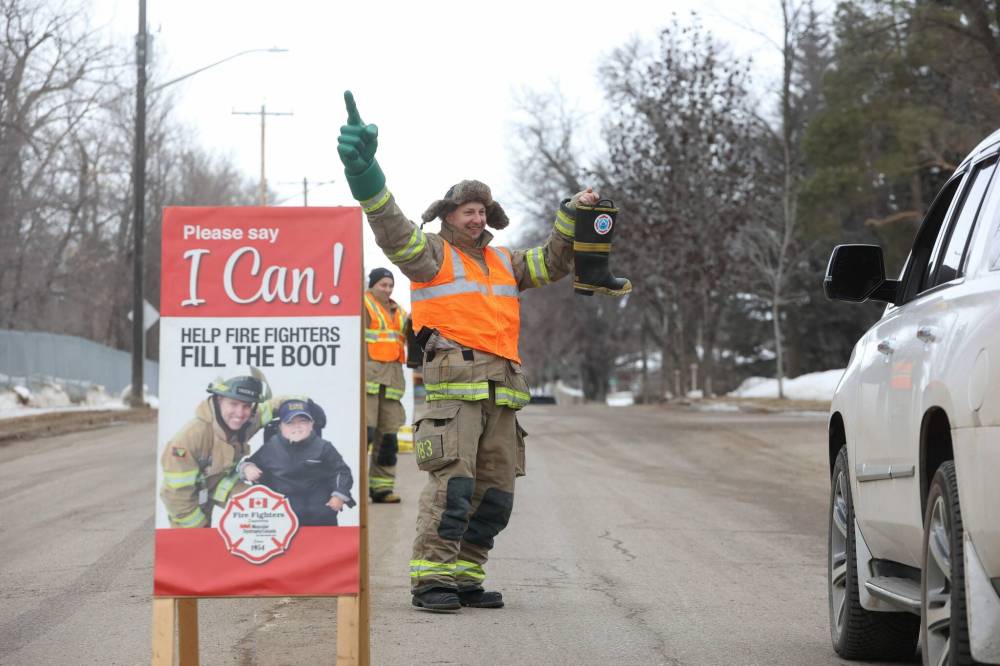 Travis Tannas with Brandon Fire and Emergency Services is seen during last week's campout and boot drive that raised $46,590.14 for muscular dystrophy, cerebral palsy and the Brandon Firefighter Charity Fund. (Tim Smith/The Brandon Sun files)