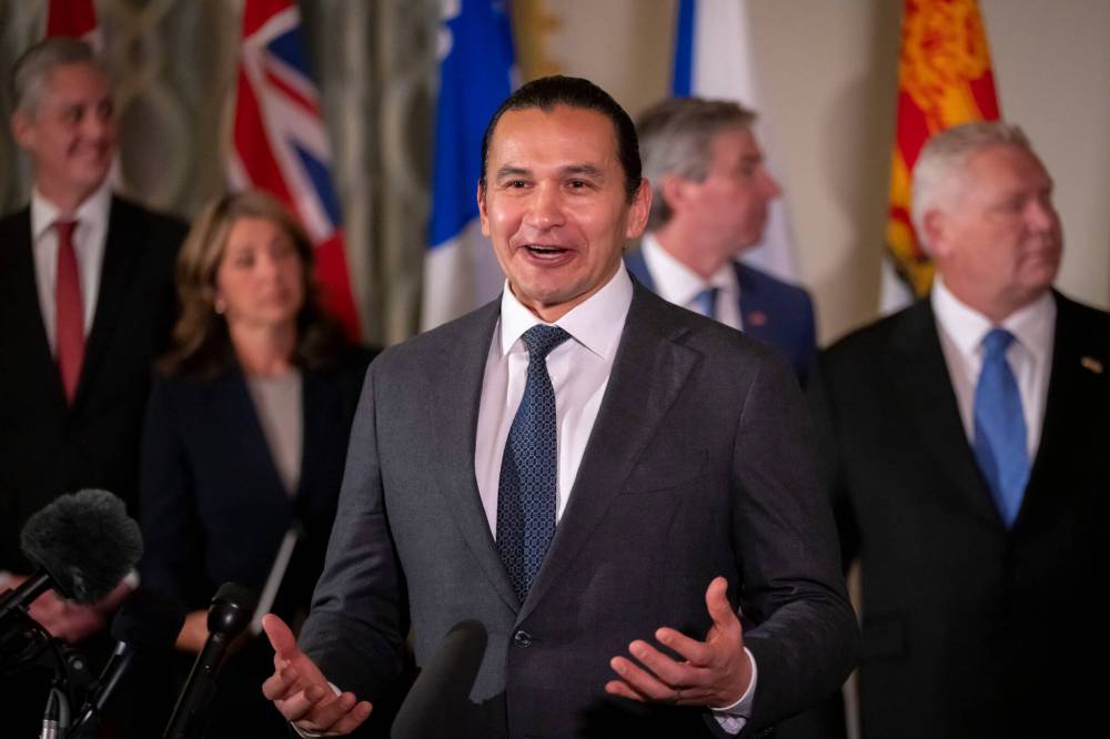 Premier Wab Kinew, accompanied by other Council of the Federation members, speaks to reporters at the Mayflower Hotel in Washington on Feb. 12. (The Associated Press files)