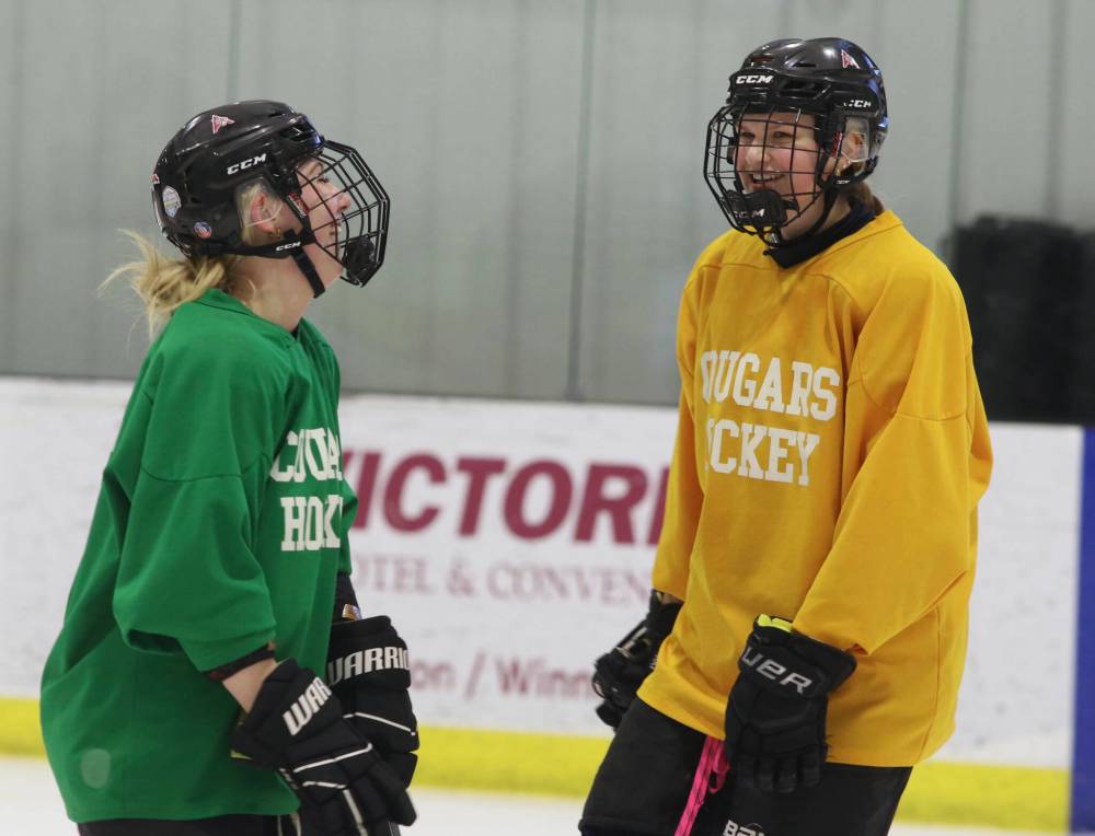 The Assiniboine Cougars have been enjoying the last two weeks of practise but know it will soon be time to get back to business. Kasey Fouillard and Lexy Waddell share a laugh at one of the team’s final tune-ups ahead of the ACHA championship. (Matt Packwood/The Brandon Sun)