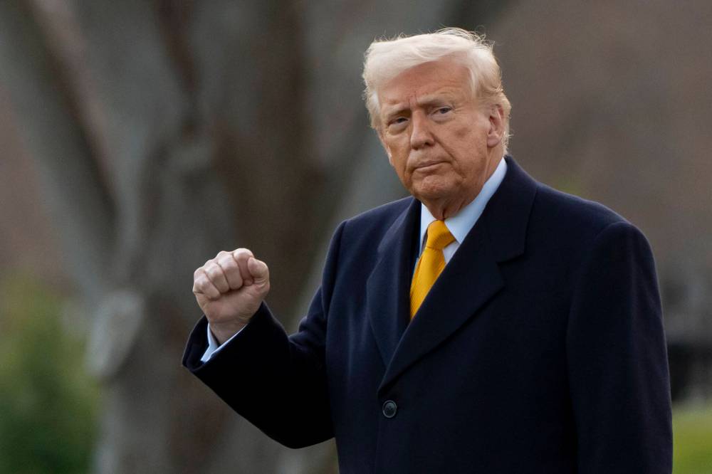 U.S. President Donald Trump pumps his fist before departing on Marine One from the South Lawn of the White House in Washington on March 7. Trump's rhetoric has made the once unthinkable now seem a disturbing possibility. Do Canadians need to worry about a U.S. invasion? (File)