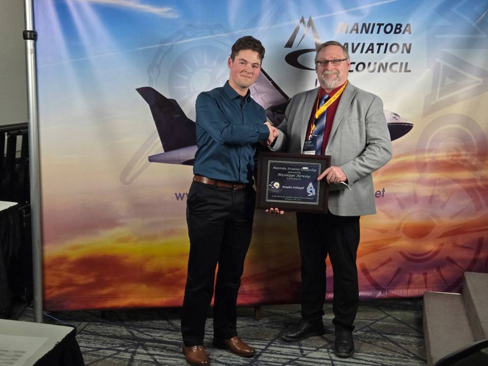 Missinippi Airways representative Ricky Brenton (right) presents the Manitoba Aviation Scholarship to Brandon Flight Centre student Braydon Fothergill during the Manitoba Aviation Conference banquet at Holiday Inn Express Polo Park Winnipeg recently. (Submitted)