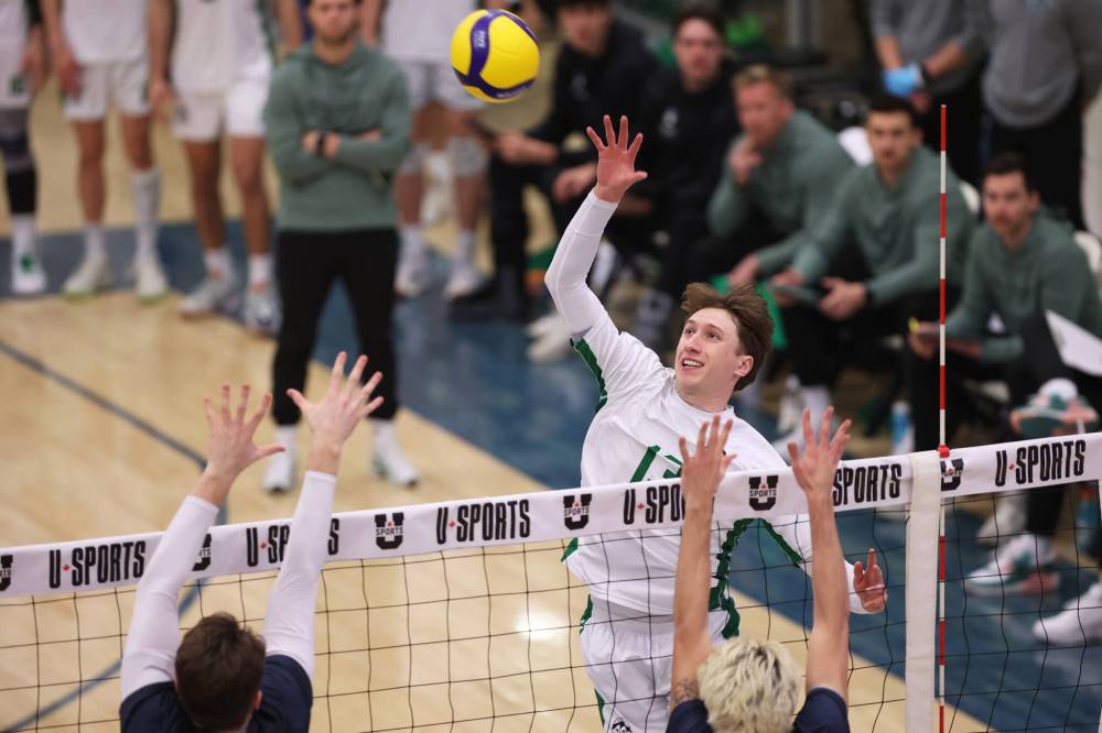 Isaiah Mamer of the Saskatchewan Huskies attacks against the Queen’s Gaels during the fourth U Sports men’s volleyball quarterfinal on Friday night. (Tim Smith/The Brandon Sun)