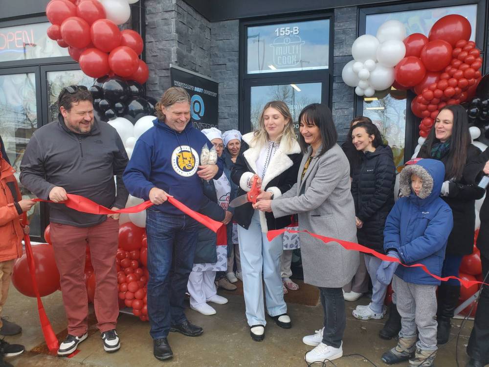 Brandon East MLA Glen Simard (from left) and Brandon Mayor Jeff Fawcett join owners Kateryna Doboshynska and Oksana Golovka to cut the ribbon at their business’s opening ceremony, as Downtown BIZ executive director Emmy Sanderson watches Saturday. (Abiola Odutola/The Brandon Sun)