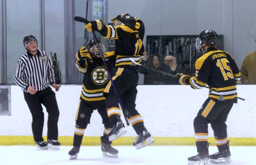 Winnipeg Bruins forward Mitchell Hill (11) jumps into the arms of teammate Dryden Fougere (6) as Triton Joudrey (15) joins the celebration for what proved to be the winning goal in a 3-2 victory over the Brandon Wheat Kings in Game 4 to complete the sweep in the U17 AAA Winnipeg Hockey League championship on Saturday afternoon at J&G Homes Arena. (Perry Bergson/The Brandon Sun)
March 22, 2025