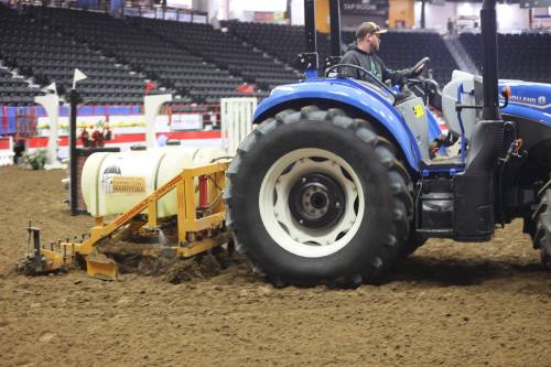 Levi Black levels the surface in Westoba Place arena, and adds moisture back into the soil to provide good footing for the horses. (Photos by Abiola Odutola/The Brandon Sun)