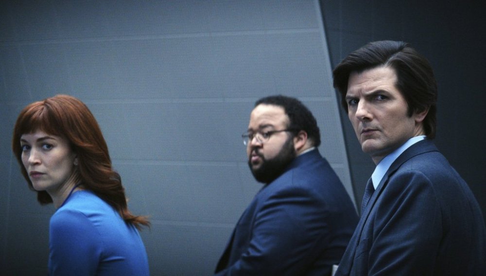 This image released by Apple TV+ shows Britt Lower, from left, Zach Cherry, Adam Scott in a scene from