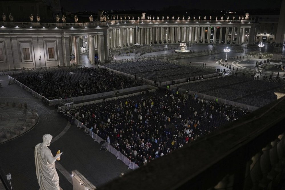 Catholic worshippers pray during a prayer of the Rosary for Pope Francis in St. Peter's Square at The Vatican, Friday, March 7, 2025. (AP Photo/Francisco Seco)