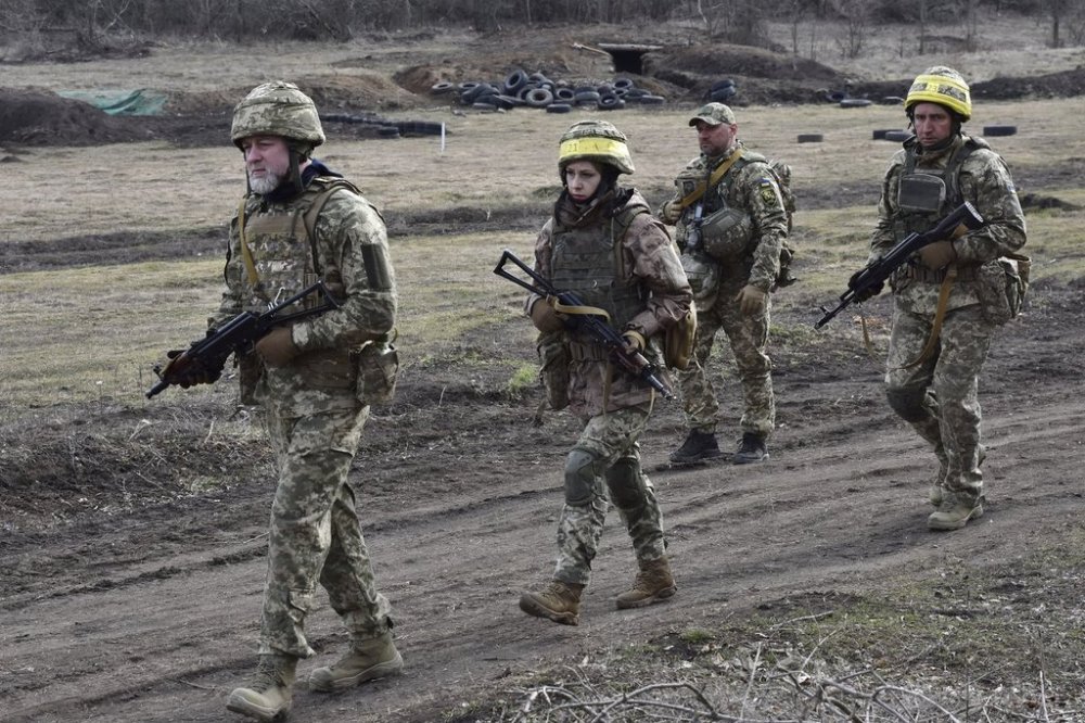 In this photo provided by Ukraine's 65th Mechanised Brigade press service, Ukrainian servicemen train at the military training ground in the Zaporizhzhia region, Ukraine, Monday, March 10, 2025. (Andriy Andriyenko/Ukraine's 65th Mechanised Brigade via AP)