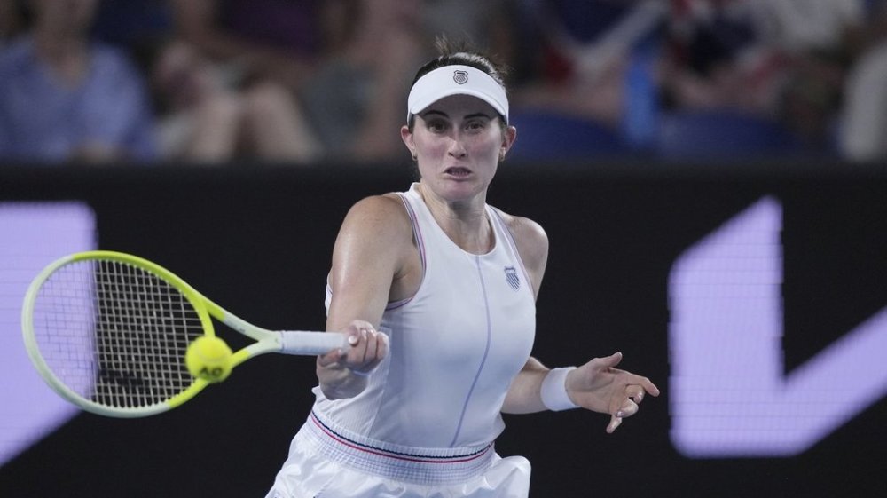 Rebecca Marino of Canada plays a forehand return to Katie Boulter of Britain during their first round match at the Australian Open tennis championship in Melbourne, Australia, Tuesday, Jan. 14, 2025. (AP Photo/Vincent Thian)
