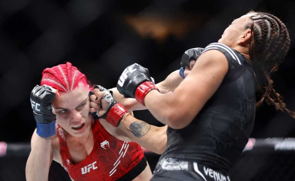 Gillian Robertson, left, and Michelle Waterson-Gomez trade punches in a strawweight bout during the UFC 303 mixed martial arts event Saturday, June 29, 2024, in Las Vegas. Waterson-Gomez announced her retirement after her loss to Robertson. THE CANADIAN PRESS/AP, Steve Marcus, Las Vegas Sun