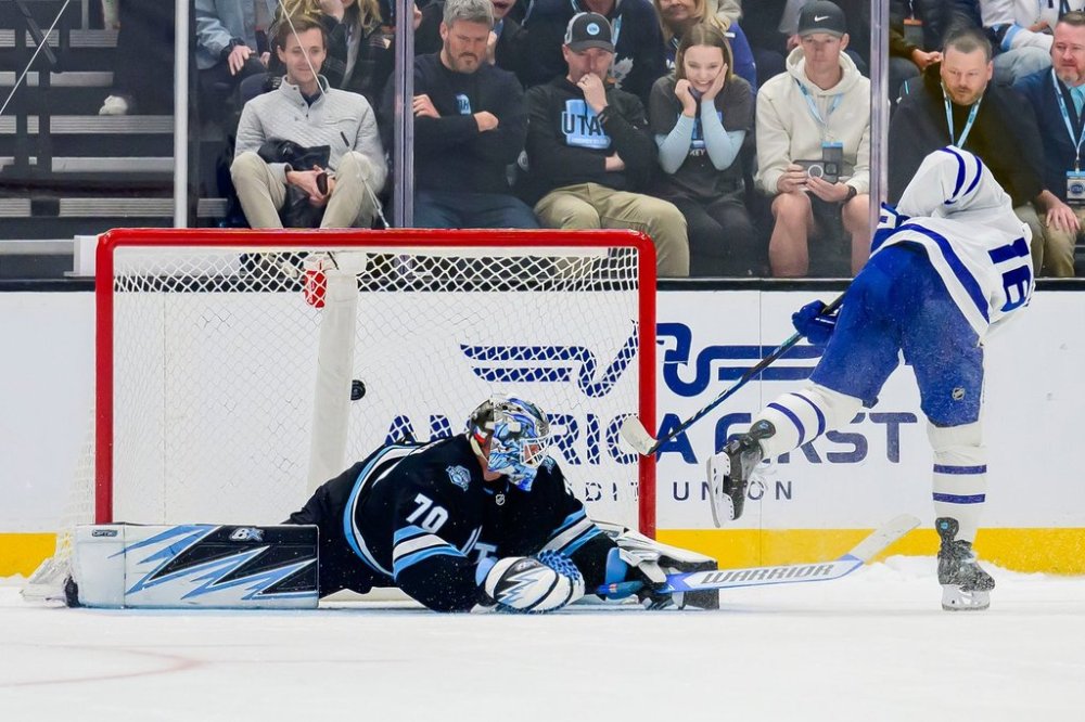Toronto Maple Leafs right wing Mitch Marner (16) scores the winning goal past Utah Hockey Club goaltender Karel Vejmelka (70) during a shootout in an NHL hockey game Monday, March 10, 2025, in Salt Lake City. (AP Photo/Tyler Tate)