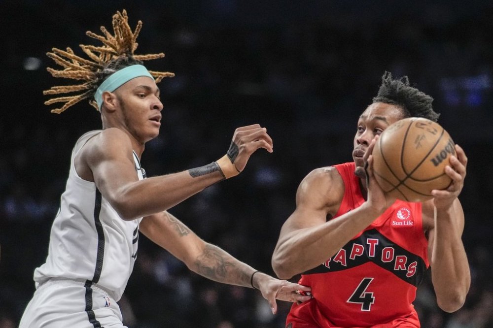 Toronto Raptors guard Scottie Barnes (4) drives to the basket against Brooklyn Nets forward Noah Clowney (21) during the first half of an NBA basketball game Wednesday, March 26, 2025, in New York. (AP Photo/Eduardo Munoz Alvarez)