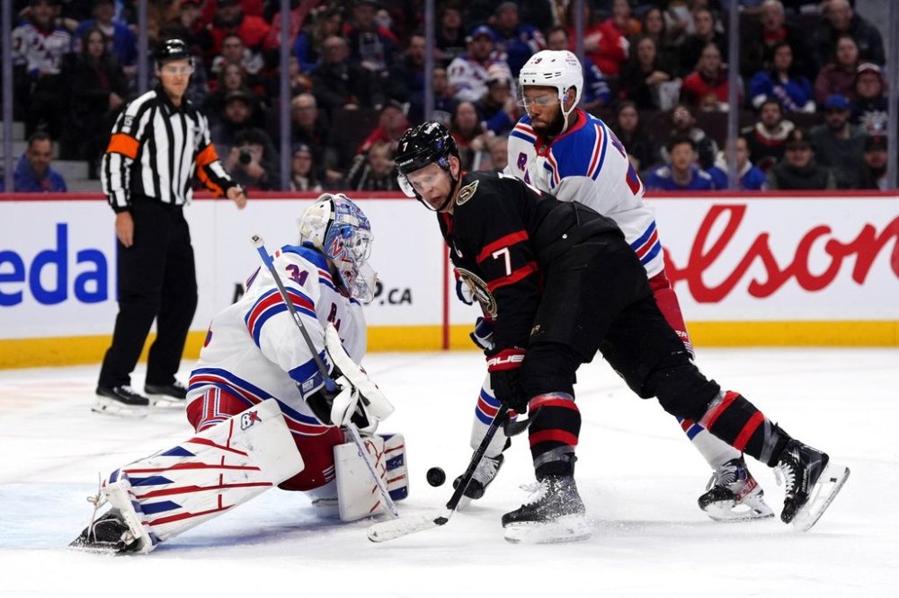 Ottawa Senators' Brady Tkachuk (7) looks for a chance on New York Rangers goaltender Igor Shesterkin (31) during second period NHL hockey action in Ottawa, on Saturday, March 8, 2025. THE CANADIAN PRESS/Justin Tang
