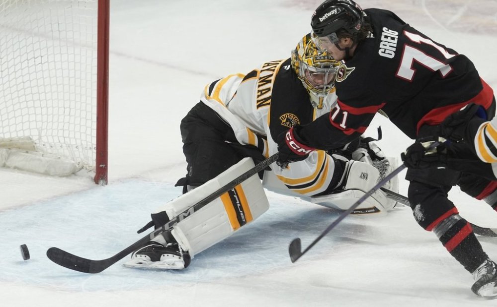 Ottawa Senators centre Ridly Greig scores on Boston Bruins goaltender Jeremy Swayman during first period NHL action, Thursday March 13, 2025 in Ottawa. THE CANADIAN PRESS/Adrian Wyld