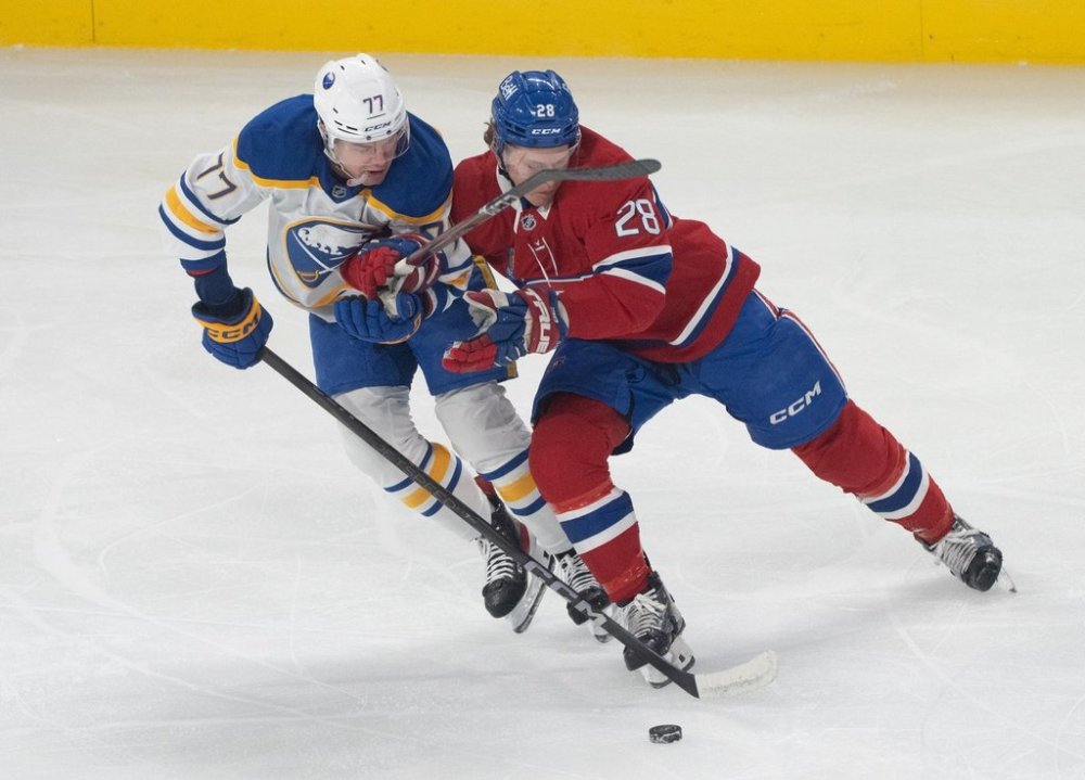 Public health officials have issued a warning about a possible exposure to measles at the Bell Centre earlier this month. Montreal Canadiens' Christian Dvorak and Buffalo Sabres' JJ Peterka battle for the puck during NHL action in Montreal, Monday, March 3, 2025. THE CANADIAN PRESS/Christinne Muschi