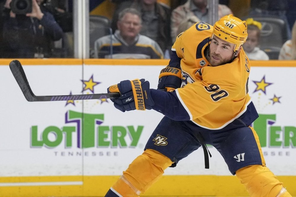 Nashville Predators centre Ryan O'Reilly (90) plays during the second period of an NHL hockey game against the Ottawa Senators, Monday, Feb. 3, 2025, in Nashville, Tenn. (AP Photo/George Walker IV)