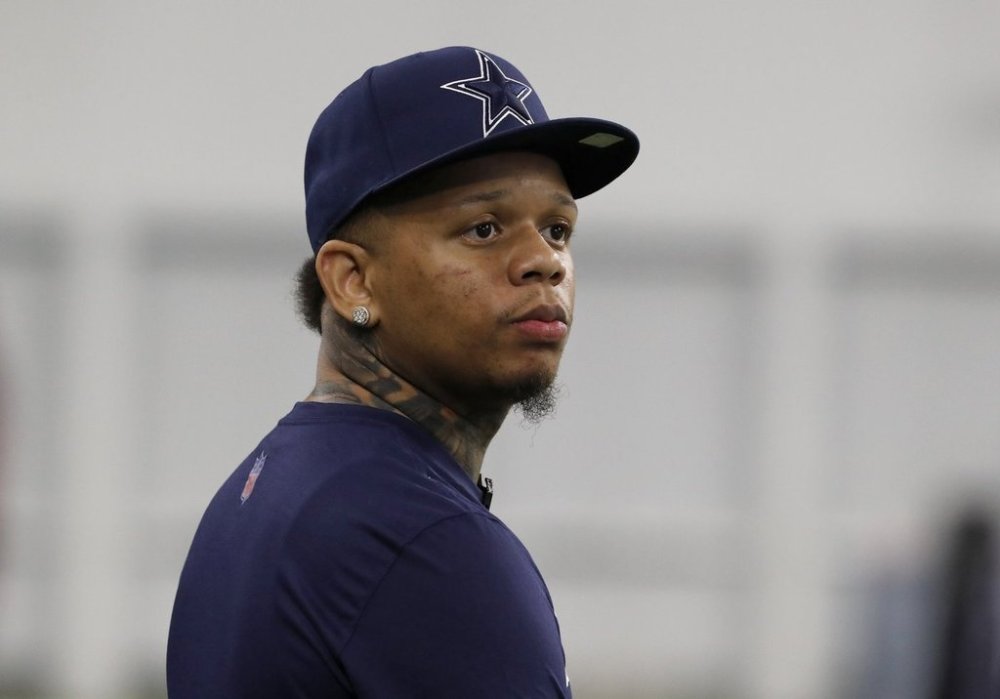 FILE - Rapper Yella Beezy watches the the Dallas Cowboys run drills at the team's NFL football training facility in Frisco, Texas, Wednesday, June 12, 2019. (AP Photo/Tony Gutierrez, File)