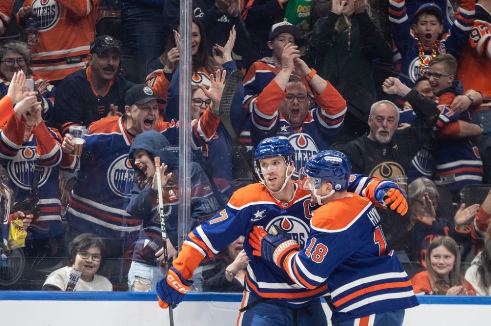Edmonton Oilers' Connor McDavid (97) and Zach Hyman (18) celebrate a goal against the Dallas Stars during second period NHL action in Edmonton on Saturday, March 8, 2025. THE CANADIAN PRESS/Jason Franson