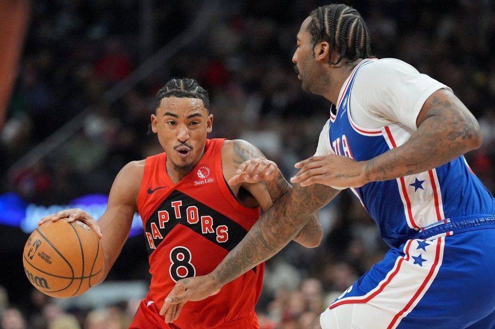 Philadelphia 76ers centre Andre Drummond (1) defends as Toronto Raptors guard Jared Rhoden (8) drives the ball up court during first half NBA basketball action in Toronto, Wednesday, March 12, 2025. THE CANADIAN PRESS/Frank Gunn