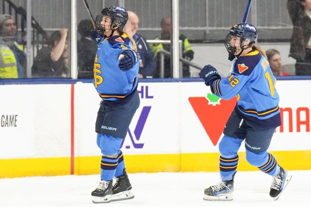 Toronto Sceptres' Daryl Watts (left) celebrates scoring against the New York Sirens as Allie Munroe skates in during first period PWHL hockey action in Toronto, on Wednesday, March 19, 2025. THE CANADIAN PRESS/Chris Young