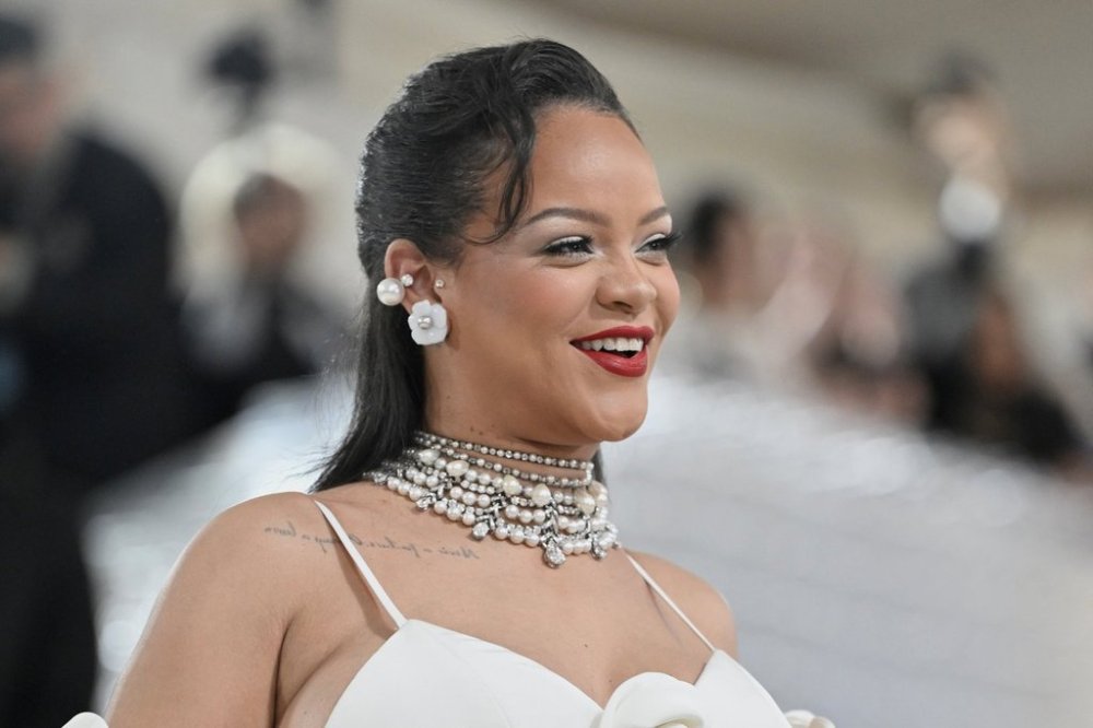 FILE - Rihanna shows off her baby bump at The Metropolitan Museum of Art's Costume Institute benefit gala celebrating the opening of the