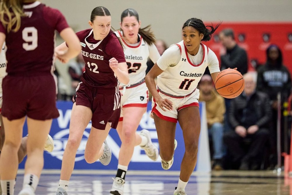 University of Carleton Ravens' Kyana-Jade Poulin moves the ball up the court against the University of Ottawa Gee-Gees during U Sports women's basketball action in Ottawa in this March 8, 2025 handout photo. THE CANADIAN PRESS/HO, Marc Lafleur *MANDATORY CREDIT*