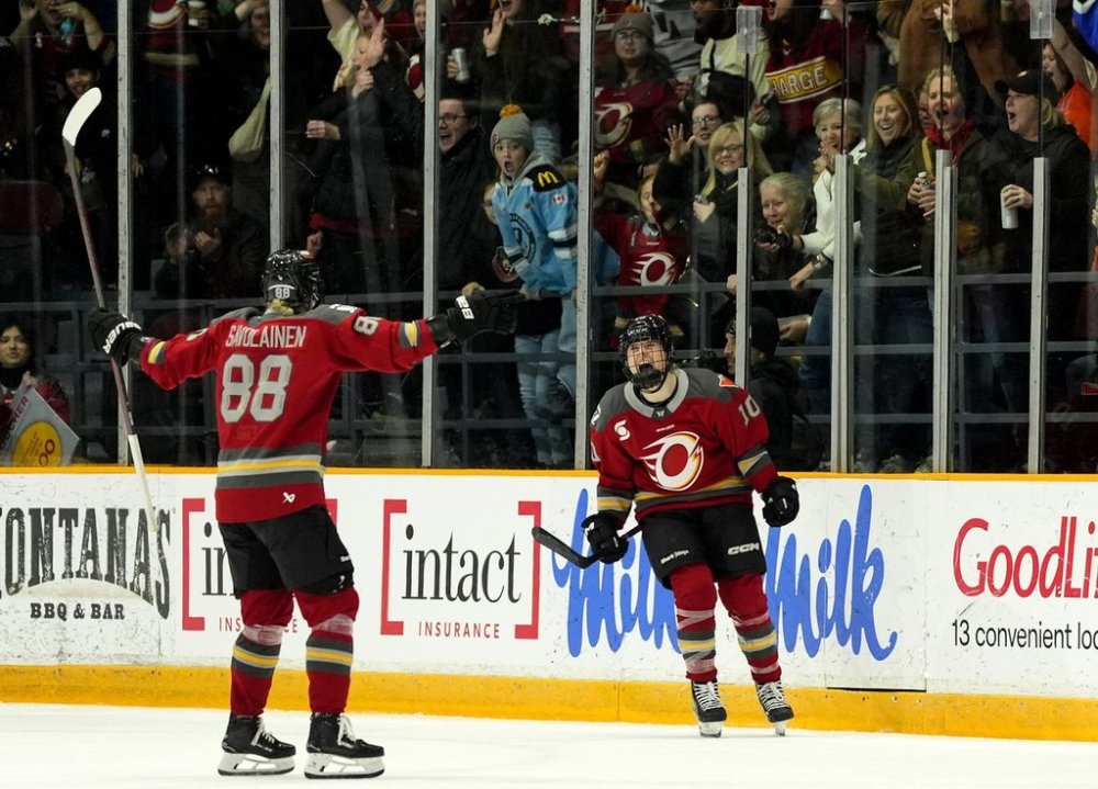 Ottawa Charge's Alexa Vasko (10) celebrates her goal against the Minnesota Frost with Ronja Savolainen (88) during second period PWHL hockey action in Ottawa, on Tuesday, March 11, 2025. THE CANADIAN PRESS/Justin Tang